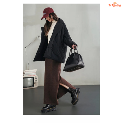 A black cotton-padded puffer coat for women with a collared design, thick warmth, covered button full opening, polyester fiber filling, and regular loose streetwear fit.
