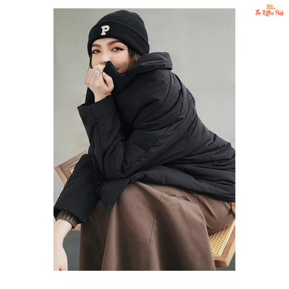 A black cotton-padded puffer coat for women with a collared design, thick warmth, covered button full opening, polyester fiber filling, and regular loose streetwear fit.
