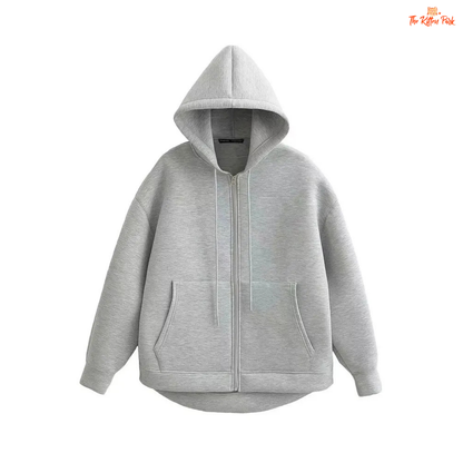 A gray hooded zipper jacket for women with soft polyester fabric, regular fit, full sleeves, pockets, and a casual office-ready design.