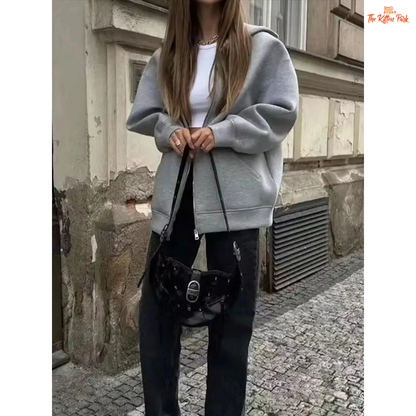 A gray hooded zipper jacket for women with soft polyester fabric, regular fit, full sleeves, pockets, and a casual office-ready design.