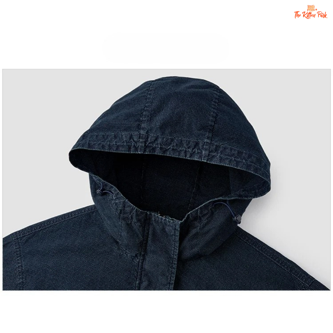 A women’s mid-length hooded denim jacket with loose fit, zipper full opening, waist-cinching detail, and cotton–polyester blend for spring and summer casual wear.