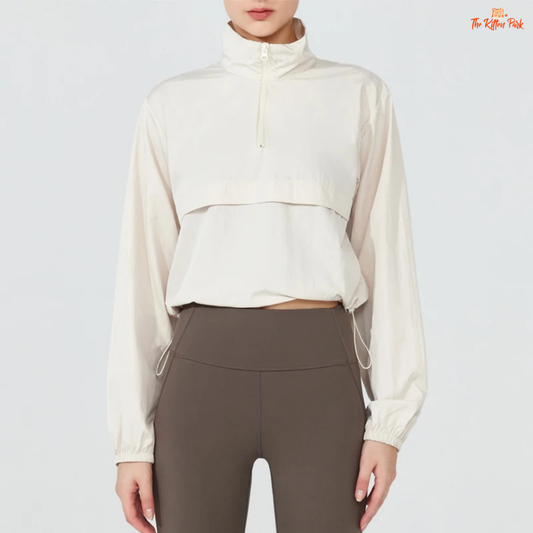 Women's lightweight quarter-zip windbreaker jacket with UPF50+ sun protection, breathable waterproof nylon, and cropped sporty design.