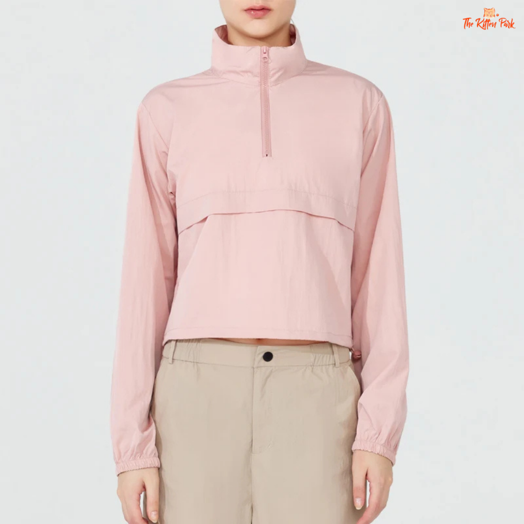 Women's lightweight quarter-zip windbreaker jacket with UPF50+ sun protection, breathable waterproof nylon, and cropped sporty design.