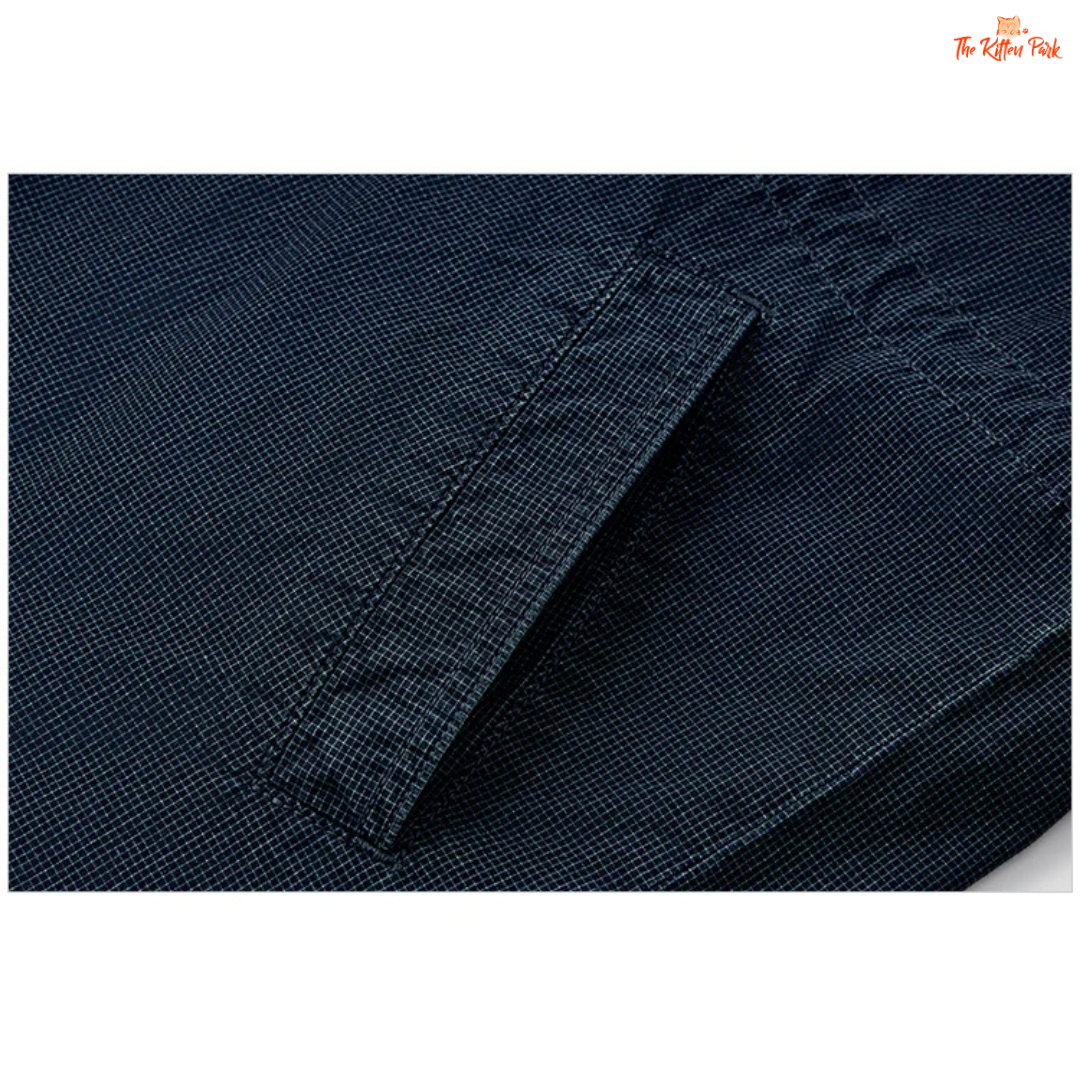 A women’s mid-length hooded denim jacket with loose fit, zipper full opening, waist-cinching detail, and cotton–polyester blend for spring and summer casual wear.