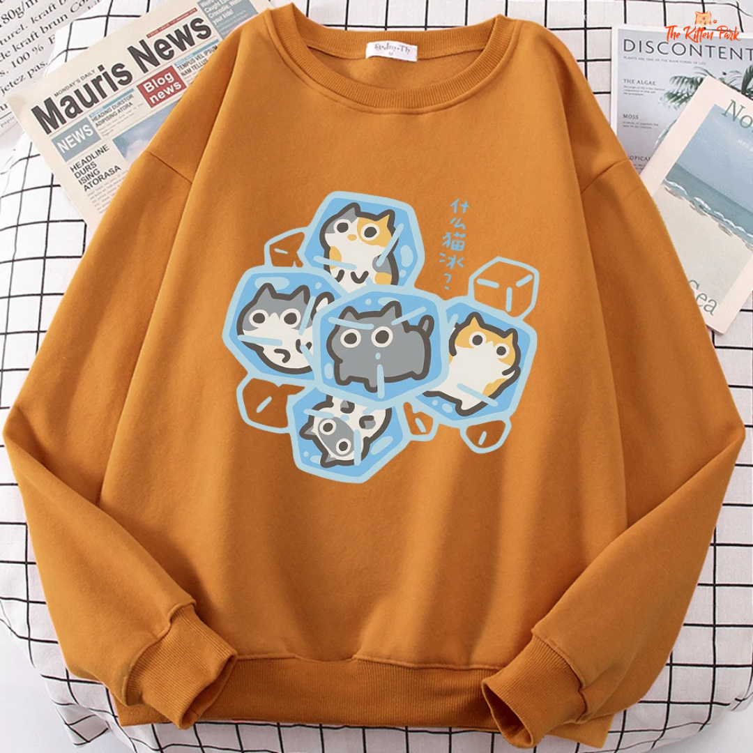 Orange sweatshirt with cartoon cat design on a checkered background