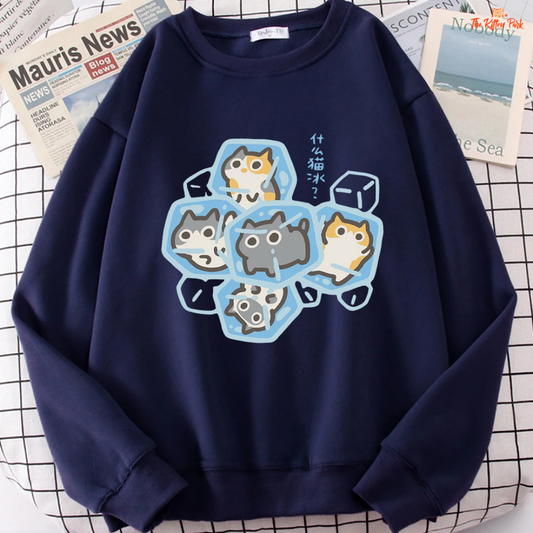 Navy blue sweatshirt with cat design on a checkered surface