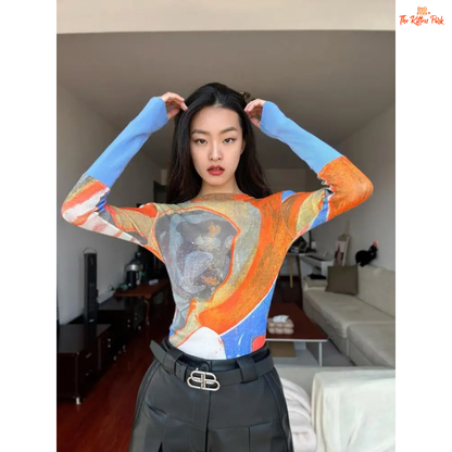Y2K-style abstract patchwork mesh top with long sleeves and slim fit, combining soft blue and orange tones for a bold streetwear statement.
