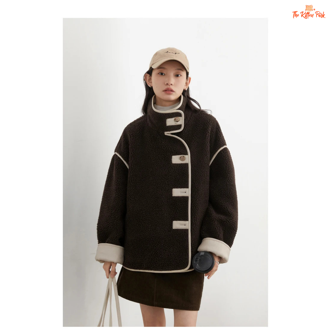 Reversible faux lamb fur jacket for women with patchwork design, turtleneck collar, and single-breasted closure for warm winter streetwear style.