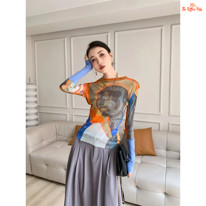 Y2K-style abstract patchwork mesh top with long sleeves and slim fit, combining soft blue and orange tones for a bold streetwear statement.