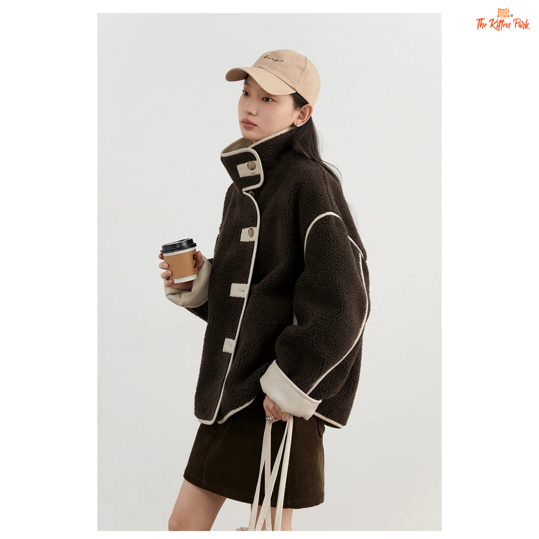 Reversible faux lamb fur jacket for women with patchwork design, turtleneck collar, and single-breasted closure for warm winter streetwear style.