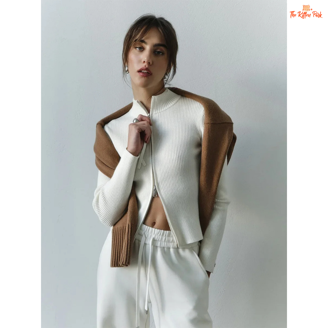 A women’s slim fit knit cardigan with a stand collar, long sleeves, and double zipper closure in a versatile office-ready style.