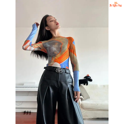 Y2K-style abstract patchwork mesh top with long sleeves and slim fit, combining soft blue and orange tones for a bold streetwear statement.