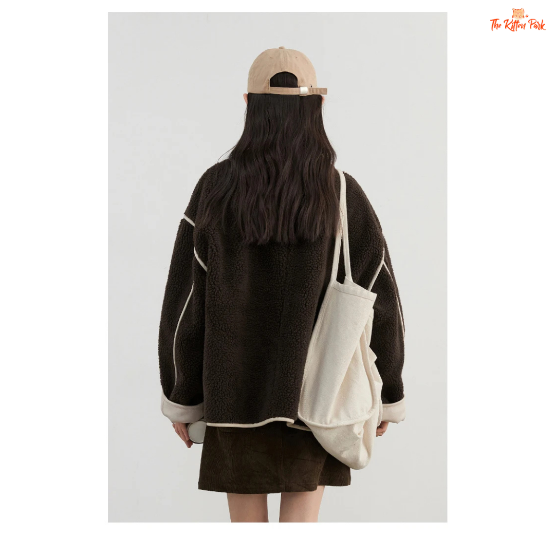 Reversible faux lamb fur jacket for women with patchwork design, turtleneck collar, and single-breasted closure for warm winter streetwear style.
