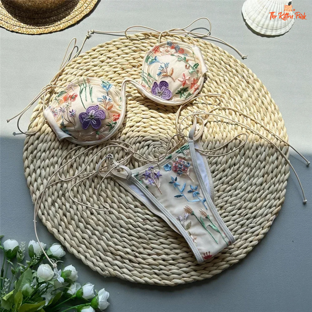 Sexy micro thong bikini with floral embroidery, red string design, low waist, and wire-free padded support for summer beachwear.