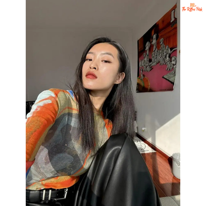 Y2K-style abstract patchwork mesh top with long sleeves and slim fit, combining soft blue and orange tones for a bold streetwear statement.