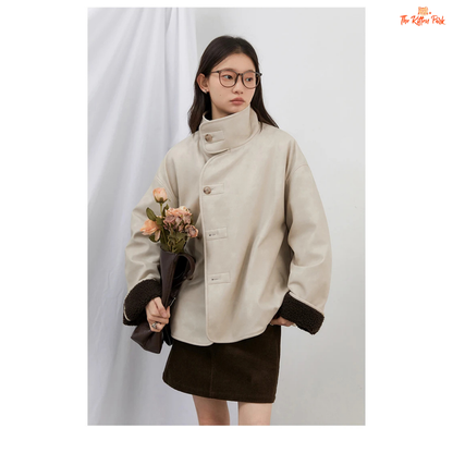 Reversible faux lamb fur jacket for women with patchwork design, turtleneck collar, and single-breasted closure for warm winter streetwear style.