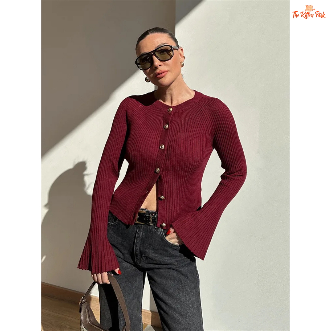 A women’s ribbed knit slim-fit cardigan with long sleeves, flare cuffs, and button closure, styled for chic high-street fashion.