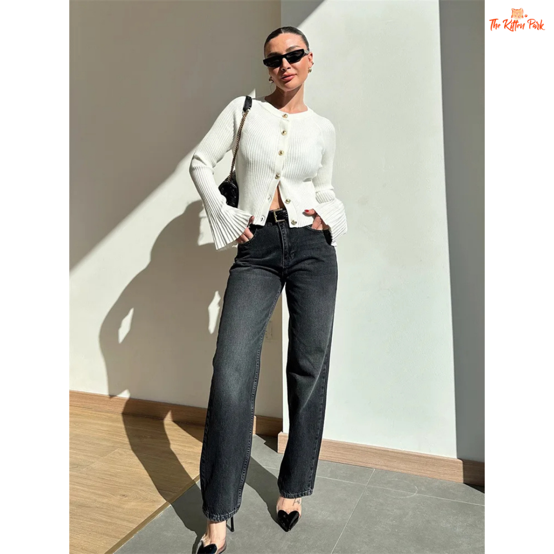 A women’s ribbed knit slim-fit cardigan with long sleeves, flare cuffs, and button closure, styled for chic high-street fashion.