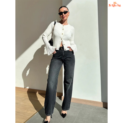 A women’s ribbed knit slim-fit cardigan with long sleeves, flare cuffs, and button closure, styled for chic high-street fashion.