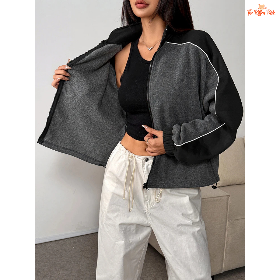 A women’s thick knitted zipper coat featuring a patchwork design, turn-down collar, and full front zipper