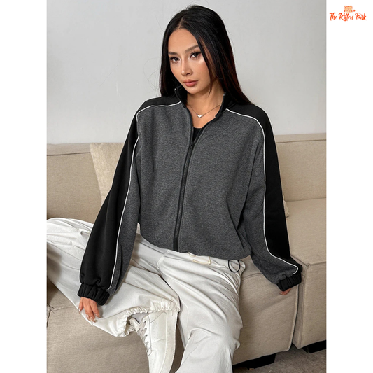 A women’s thick knitted zipper coat featuring a patchwork design, turn-down collar, and full front zipper