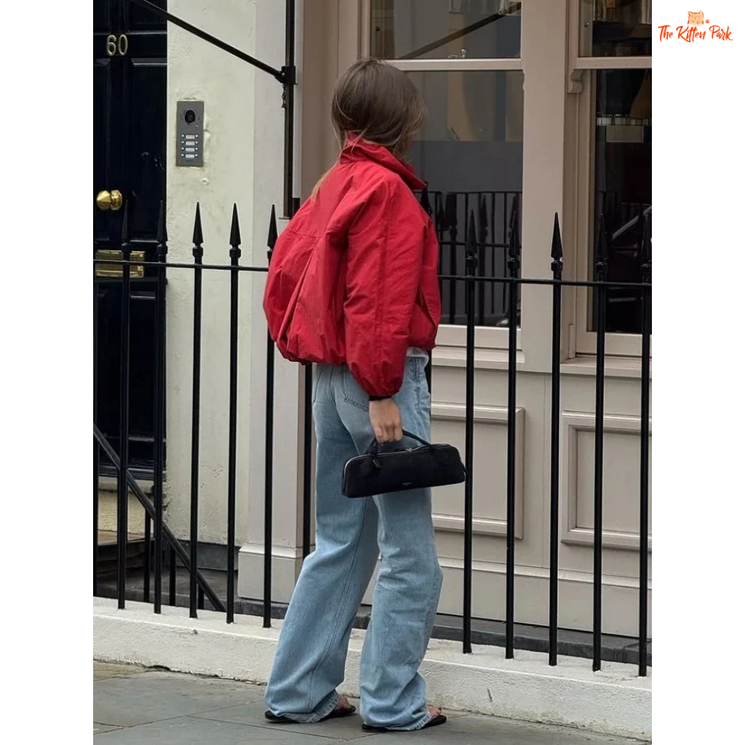 A women’s red short cotton jacket with stand collar, single-breasted closure, and pockets, designed in a slim retro streetwear style.
