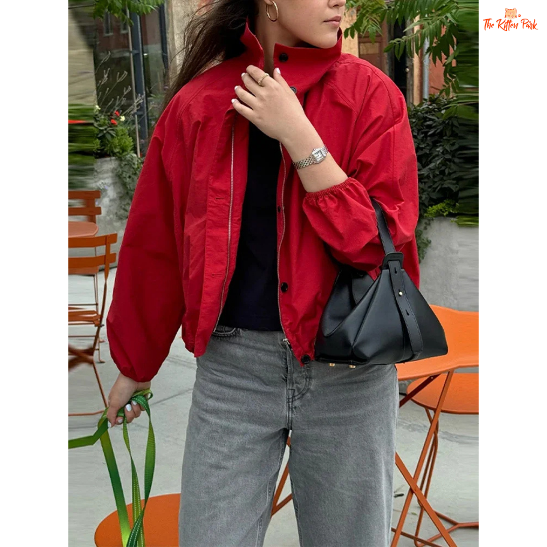 A women’s red short cotton jacket with stand collar, single-breasted closure, and pockets, designed in a slim retro streetwear style.