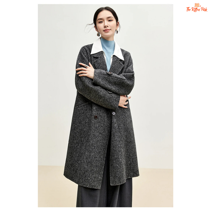 Women’s long woolen winter coat with double-breasted design, turn-down collar, button details, and thick wool blend.