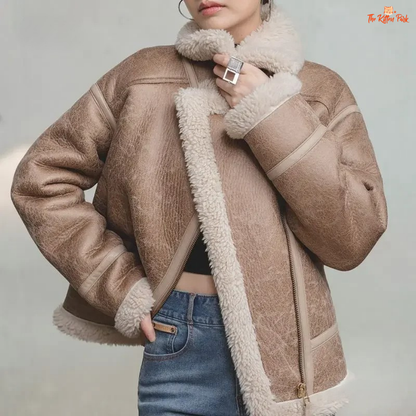 Apricot faux lamb fur leather jacket for women with thick warm lining, turn-down collar, zipper closure, and biker style for autumn and winter.