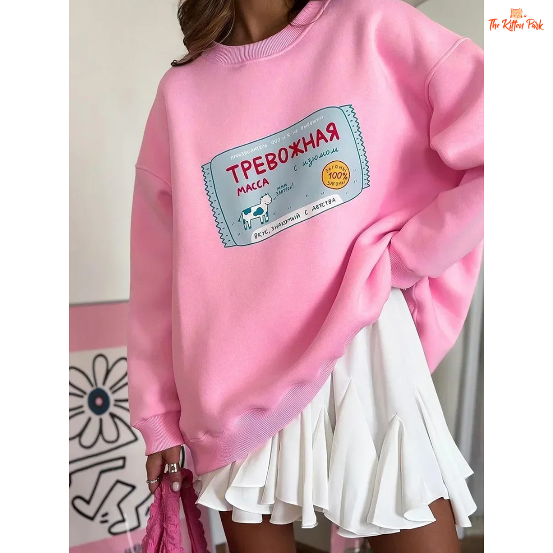 A women’s oversized cotton-polyester sweatshirt with round neck, drop-shoulder sleeves, pullover style, and printed design for autumn/winter wear.