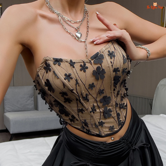 Y2K vintage sleeveless crop corset with 3D floral appliques, fishbone shaping, and slight stretch in a soft polyester blend.