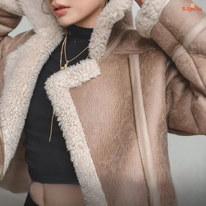 Apricot faux lamb fur leather jacket for women with thick warm lining, turn-down collar, zipper closure, and biker style for autumn and winter.
