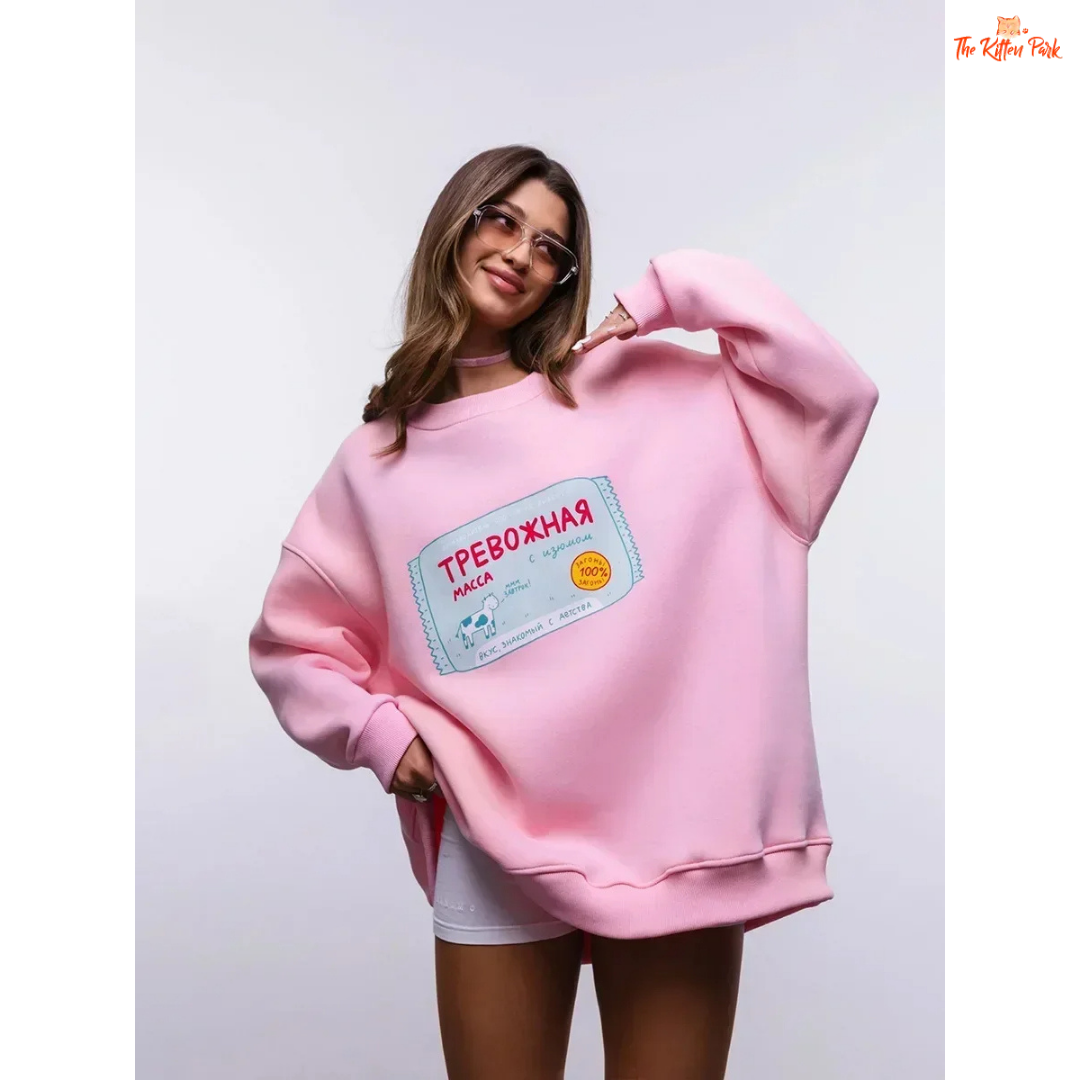 A women’s oversized cotton-polyester sweatshirt with round neck, drop-shoulder sleeves, pullover style, and printed design for autumn/winter wear.