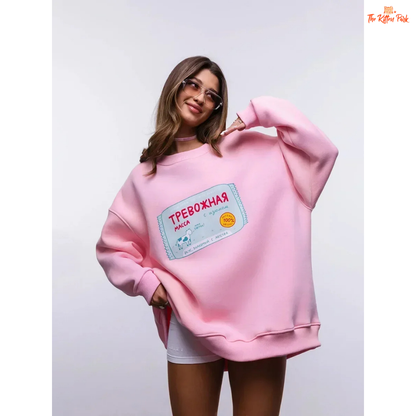 A women’s oversized cotton-polyester sweatshirt with round neck, drop-shoulder sleeves, pullover style, and printed design for autumn/winter wear.