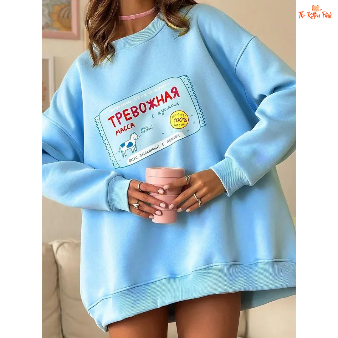 A women’s oversized cotton-polyester sweatshirt with round neck, drop-shoulder sleeves, pullover style, and printed design for autumn/winter wear.