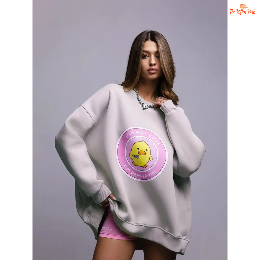 A women’s oversized cotton pullover sweatshirt with hooded collar, drop sleeves, and print design, styled for autumn/winter casual wear.