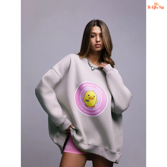 A women’s oversized cotton pullover sweatshirt with hooded collar, drop sleeves, and print design, styled for autumn/winter casual wear.