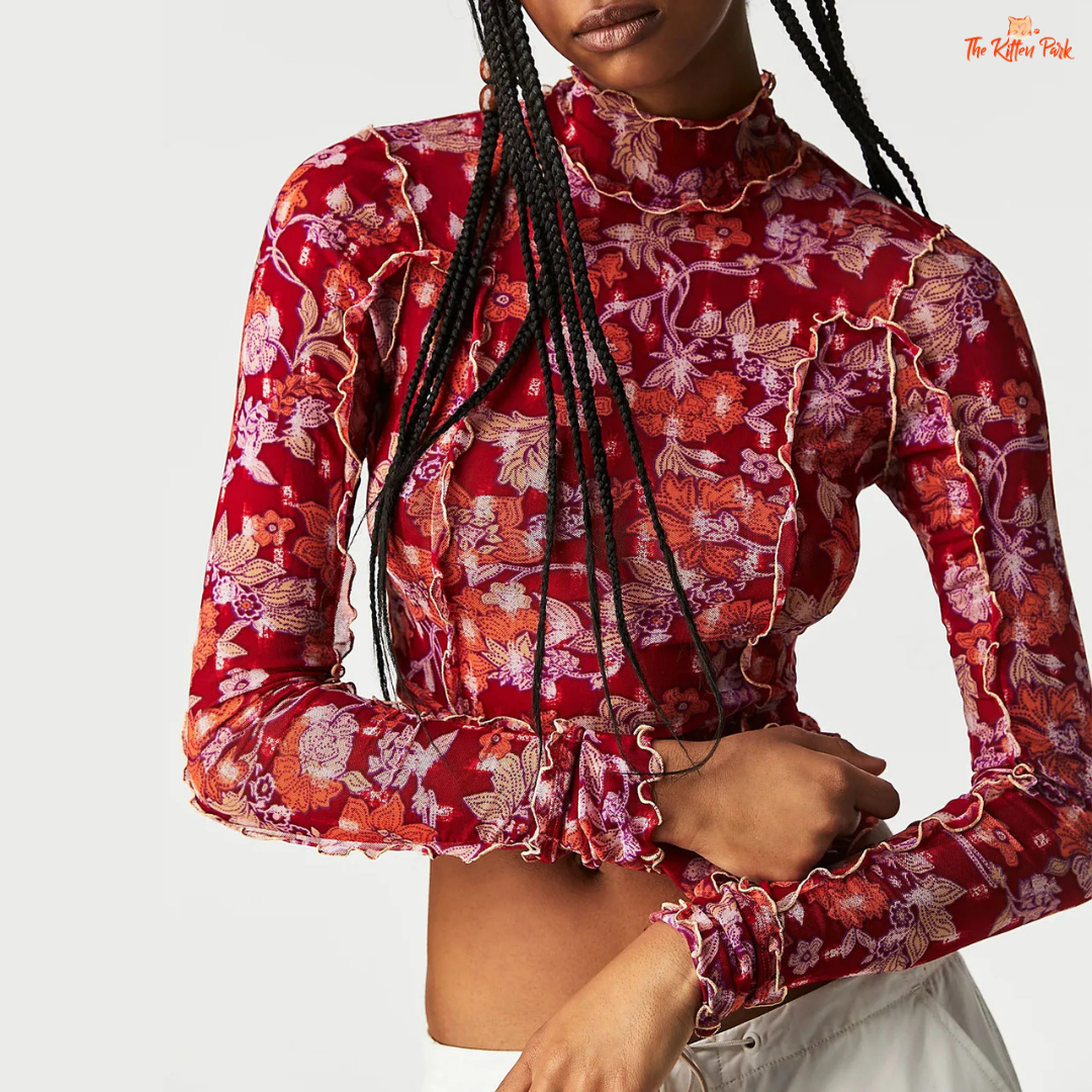 Slim-fit floral mesh top with mock neck and full sleeves, blending Y2K aesthetics and fairycore charm for dreamy summer layering.