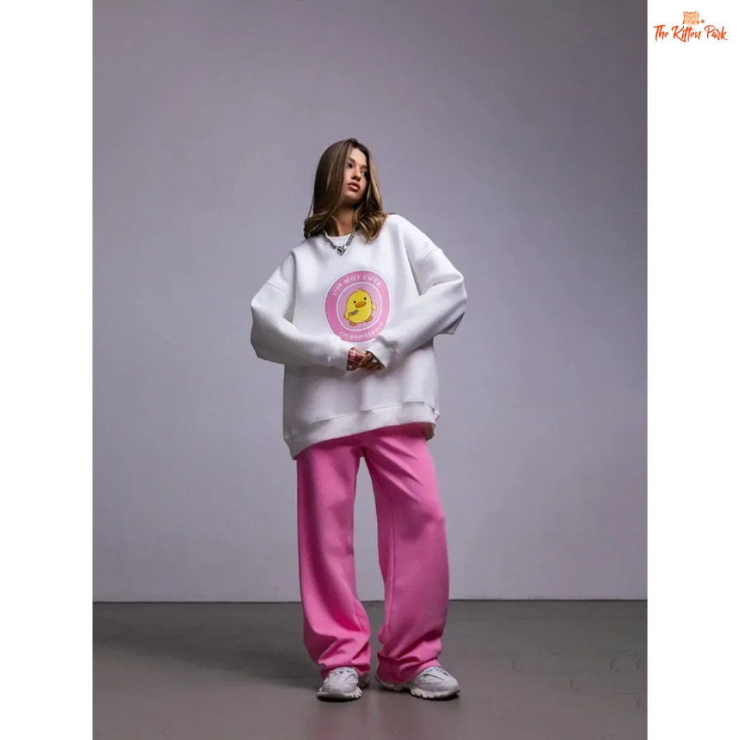 A women’s oversized cotton pullover sweatshirt with hooded collar, drop sleeves, and print design, styled for autumn/winter casual wear.