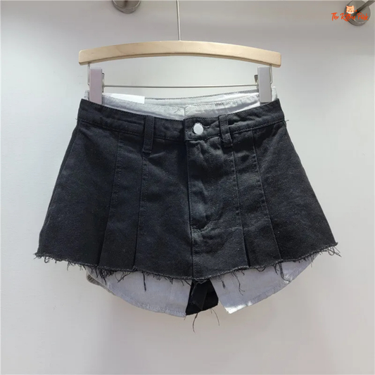High-waisted irregular A-line denim mini skirt with a fake two-piece design, perfect for casual autumn and winter outfits.