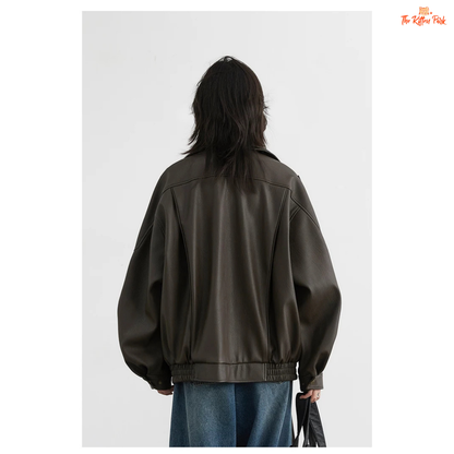 A retro PU leather jacket for women with a standing collar, single-breasted closure, and loose motorcycle coat design for autumn and spring wear.