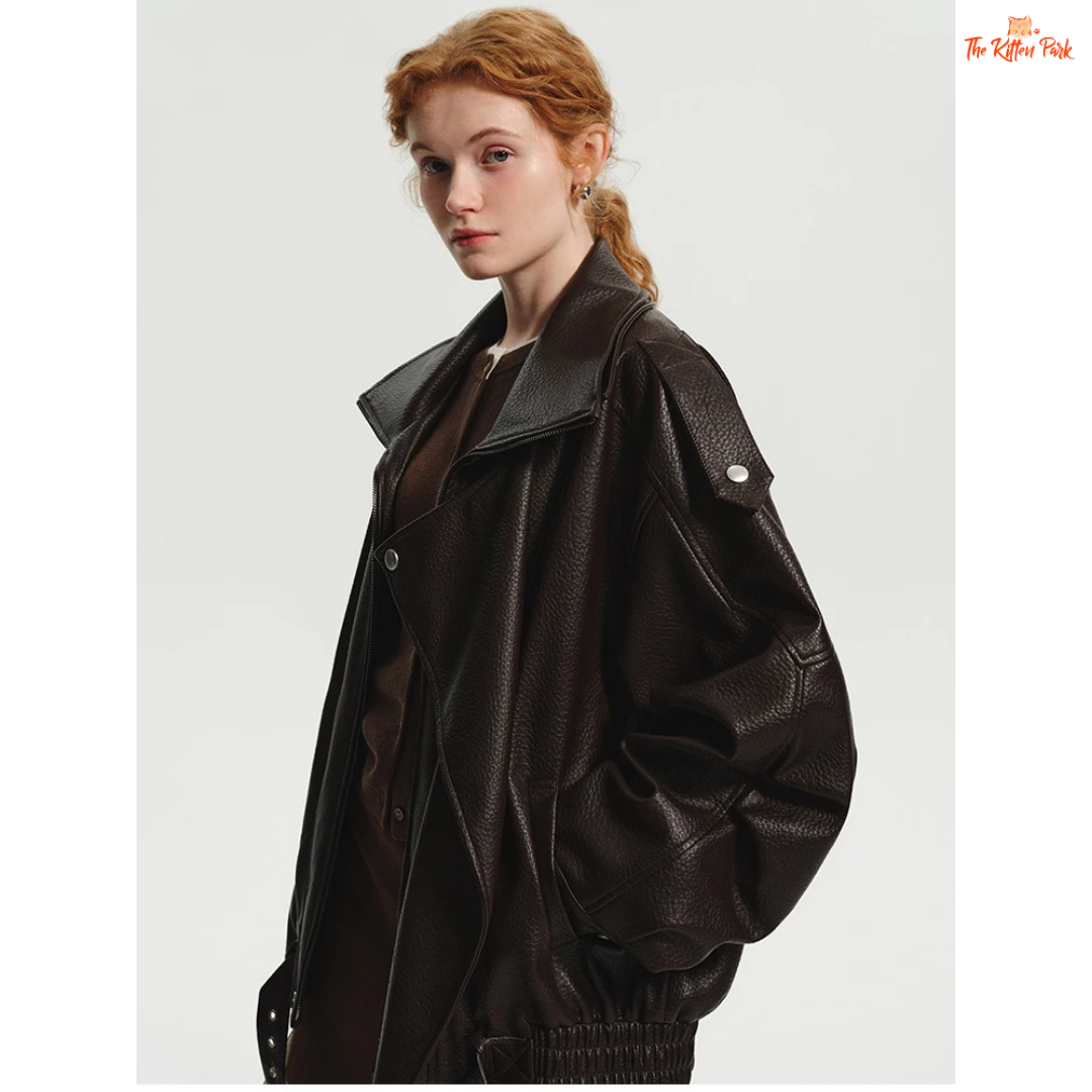 Women's oversized brown PU leather jacket with retro zip-up design, mandarin collar, and pockets — stylish high street coat for all seasons.