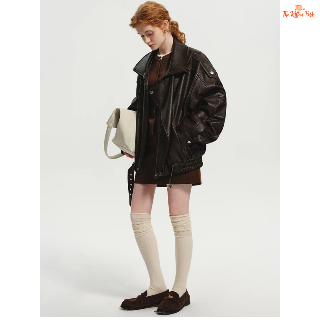 Women's oversized brown PU leather jacket with retro zip-up design, mandarin collar, and pockets — stylish high street coat for all seasons.