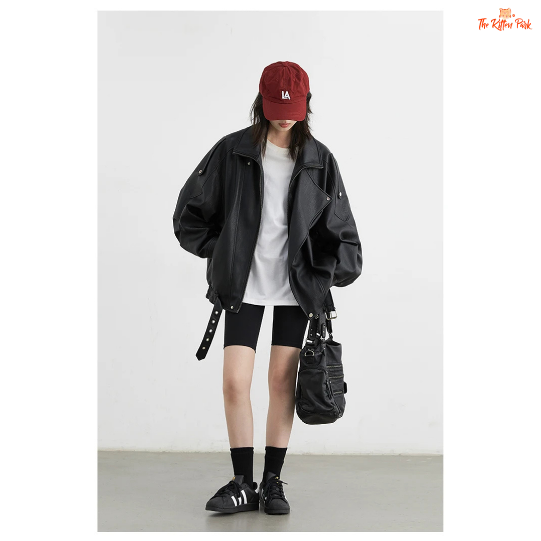 A retro PU leather jacket for women with a standing collar, single-breasted closure, and loose motorcycle coat design for autumn and spring wear.