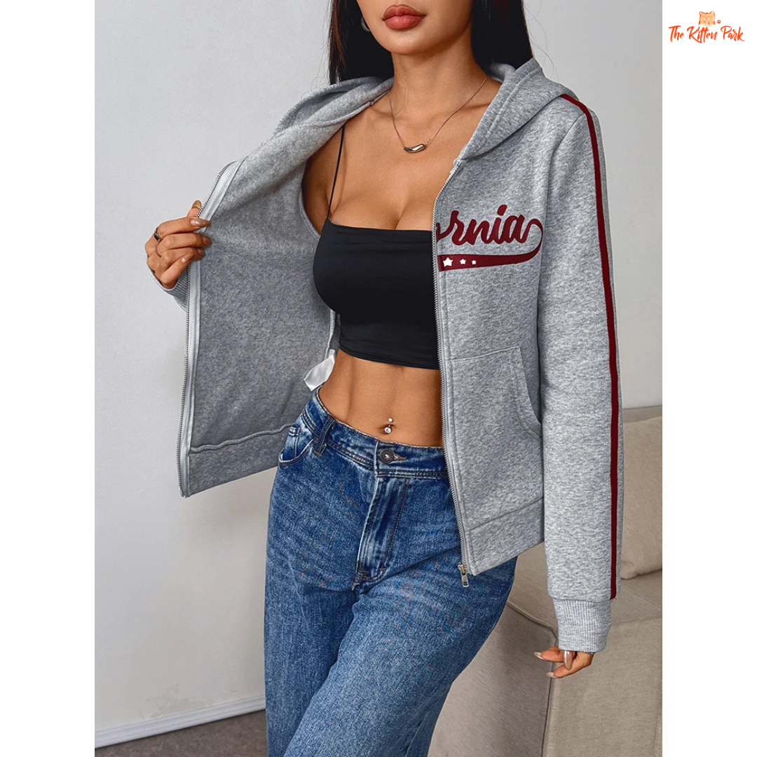 A light gray printed zipper sports hoodie for women with a hood, full zipper, and thick autumn fabric, blending sporty and streetwear style.