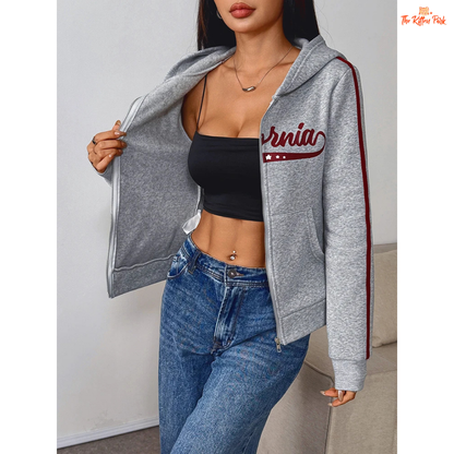 A light gray printed zipper sports hoodie for women with a hood, full zipper, and thick autumn fabric, blending sporty and streetwear style.