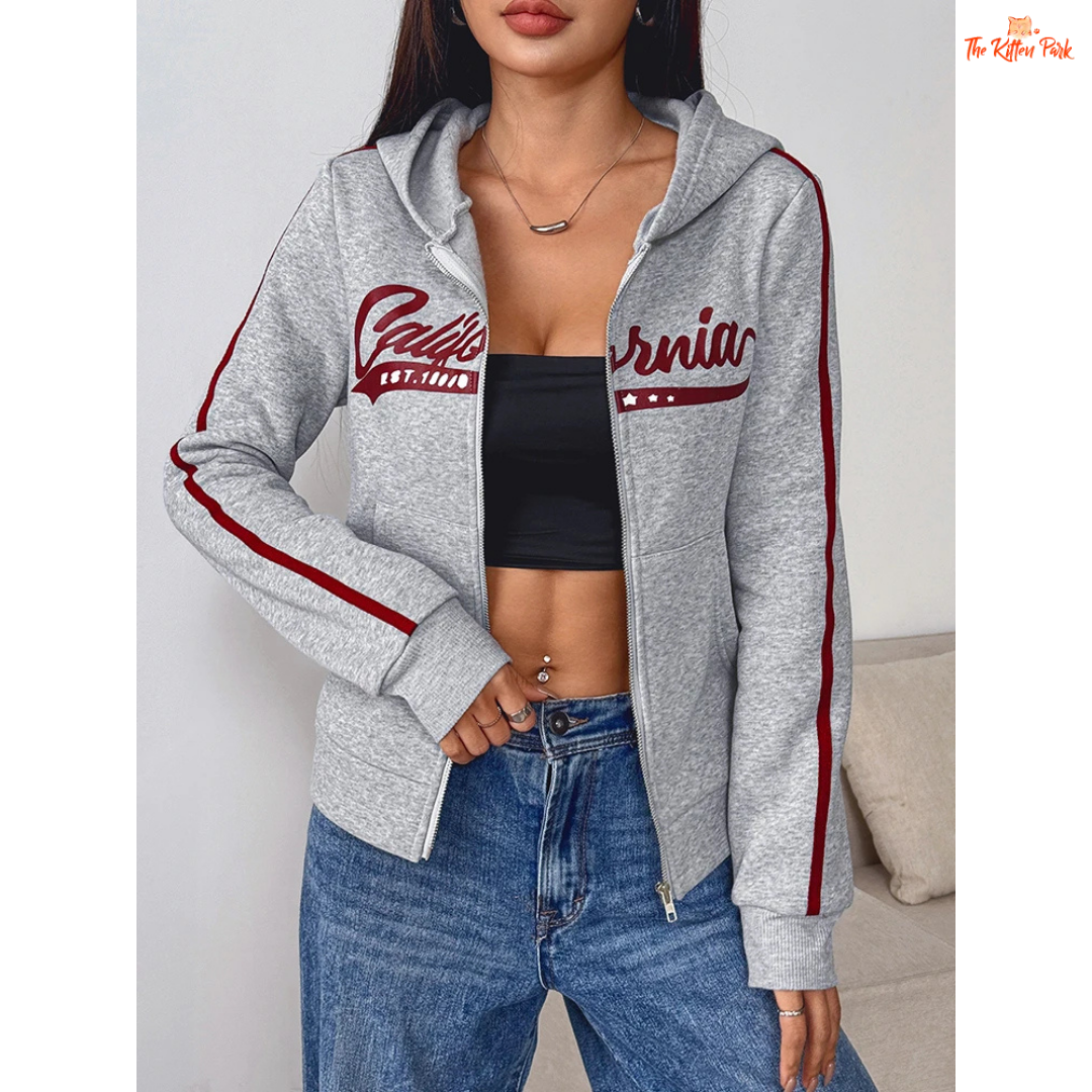 A light gray printed zipper sports hoodie for women with a hood, full zipper, and thick autumn fabric, blending sporty and streetwear style.