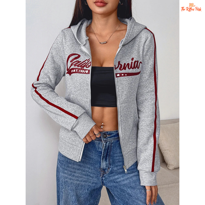 A light gray printed zipper sports hoodie for women with a hood, full zipper, and thick autumn fabric, blending sporty and streetwear style.