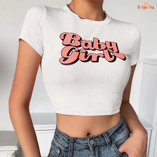 Slim-fit pink Y2K T-shirt with kawaii baby girl graphic, cropped cut, and casual style for playful spring/summer streetwear looks.