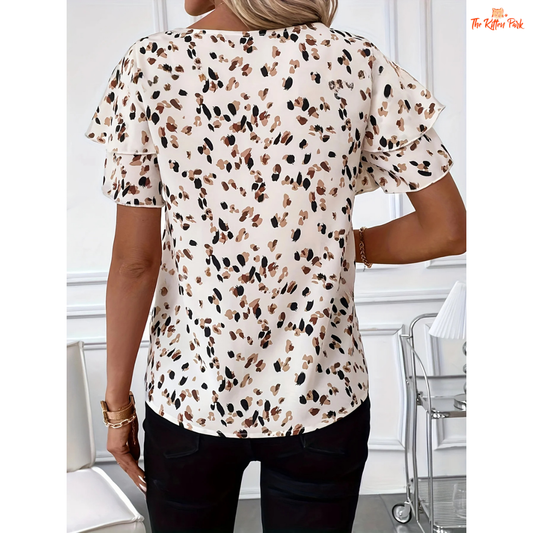 Lightweight printed blouse with ruffle sleeves, regular fit, and pullover closure, perfect for summer casual and vacation wear.